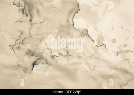 Water damaged beige paper with brown marks and coffee stains, abstract backdrop or overlay template with copy space Stock Photo