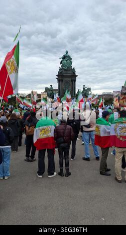 VIENNA, AUSTRIA. 17th May 2026. Demonstrators draped in pre-Islamic Revolution Iranian flags featuring the Lion and Sun emblem gather in Maria-Theresien-Platz, with Israeli and American flags also visible among the crowd, in front of the Maria Theresa Monument during a pro-Iran freedom rally. Credit: Sasa Dinic/Alamy Live News Stock Photo