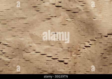 Brown wrapping paper with horizontal slits for backdrops, wrapping paper, packaging, and mockups Stock Photo