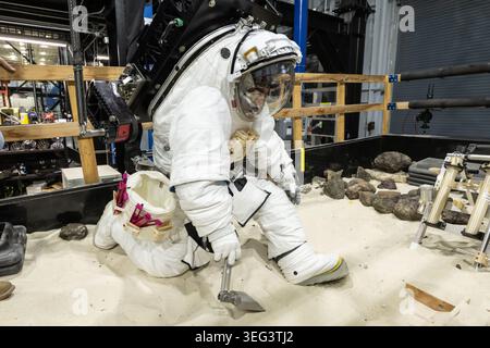 Photographic support from the Elevated Suit Pressure (ESP) Test Campaign (Data Collection 1 Run) inside Building 9E's ARGOS facility at NASA Johnson Space Center. This campaign evaluates structural mobility and joint torque of the next-generation Axiom xEVA Space Suit (AxEMU). Engineers pressurise the garment to simulate structural stresses, while ARGOS offsets its weight to collect vital human-factors mobility data for future Artemis lunar missions. 20 January 2026  Optimised version of an original NASA image. Credit: NASA/BStafford Stock Photo