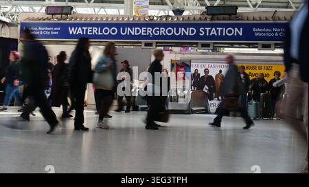 Commuters walk past the entrance to Waterloo Underground station at Waterloo railway staion Stock Photo