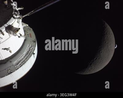 NASA's Orion spacecraft captures the Moon and the Earth in one frame during the Artemis II crew's deep space journey at 6:42 p.m. ET on the sixth day of the mission. The right side of NASA's Orion spacecraft is seen lit up by the Sun. A waxing crescent Moon is visible behind it. And then, a crescent Earth, tiny compared to the Moon, is about to set below the Moon's horizon on the right.   6 April 2026  An optimised  version of an original NASA image: Credit: NASA Stock Photo