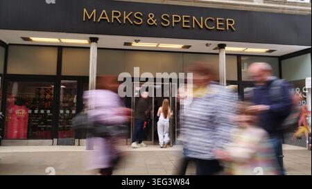 Shoppers walk past the Marks & Spncer store in Winchester, UK Stock Photo