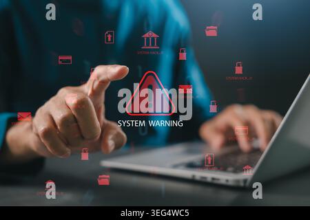 System warning attack alert cybersecurity hacking risk threat data breach information security digital protection appears as person points finger at r Stock Photo