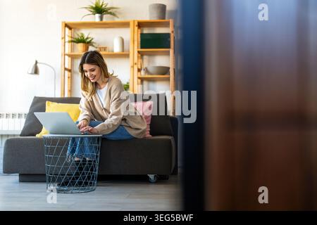 Successful female entrepreneur managing her online business from home, leading with confidence Stock Photo