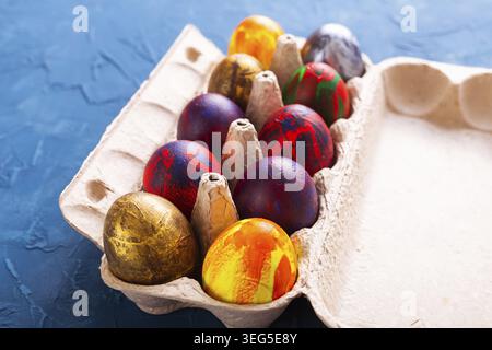 Handmade painted Easter eggs in egg box Stock Photo