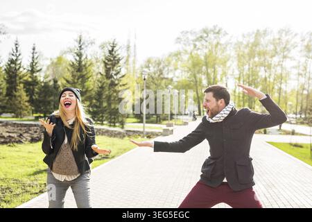 Happy couple having fun and fooling around. Joyful man with woman have nice time. Good relationship Stock Photo