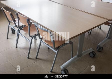School Desks And Chairs In Empty Classroom Stock Photo