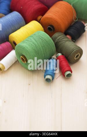 Tailoring. Many colorful threads on the table Stock Photo