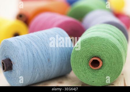 Tailoring. Many colorful threads on the table Stock Photo