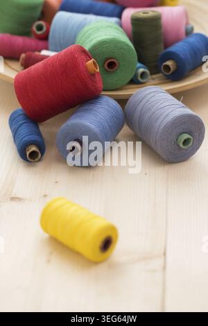 Tailoring. Many colorful threads on the table Stock Photo
