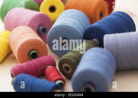 Tailoring. Many colorful threads on the table Stock Photo