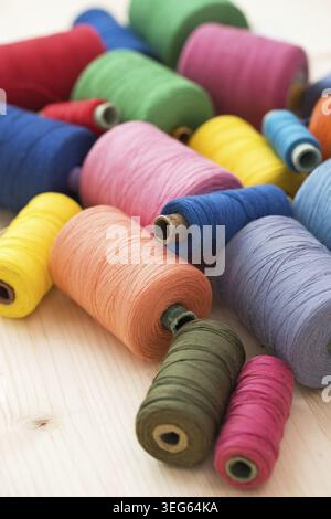 Tailoring. Many colorful threads on the table Stock Photo