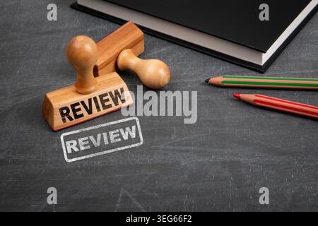 REVIEW Approval Process Shown With Wooden Stamp Document Check And Evaluation Concept Stock Photo