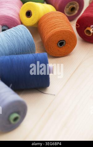 Tailoring. Many colorful threads on the table Stock Photo