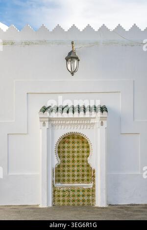 Asilah medina wall zellij tile arch traditional Moroccan architecture Stock Photo