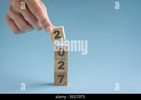 Stacking wood blocks with numbers 2027, close up view. Stock Photo