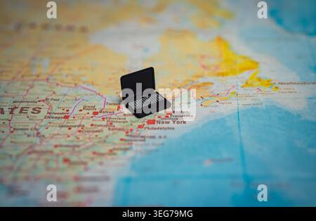 Miniature laptop on New York map stock market concept. Stock Photo