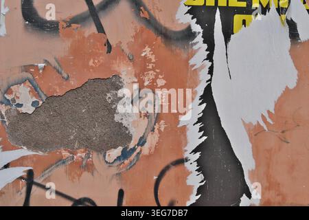 TEXTURE BACKGROUND OF AN OLD WALL WITH FALLING PLASTER Stock Photo