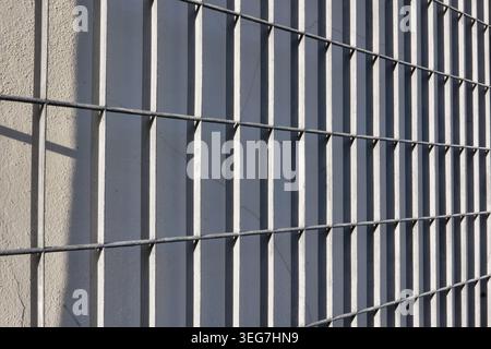 BACKGROUND TEXTURE OF A GRAY METAL GRATE Stock Photo
