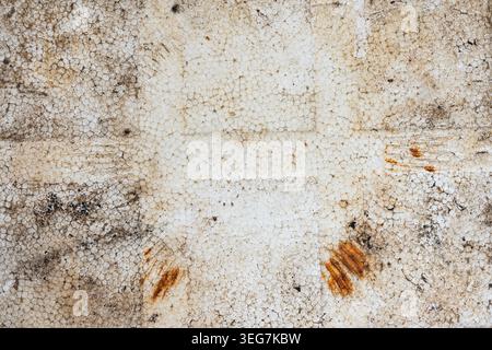 A high resolution close up of a weathered and stained polystyrene foam surface showing a distinct cellular texture with signs of decay and grime Stock Photo