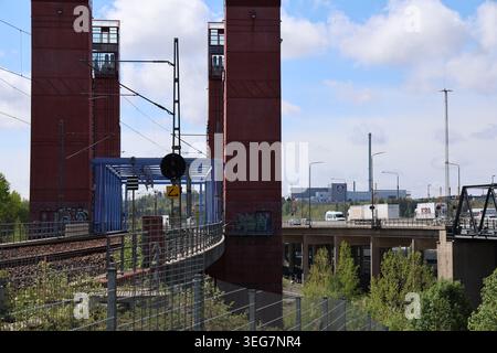 Södertälje railway bridge crossing the waterway in Södertälje, Sweden, with rail infrastructure and urban surroundings during daytime. Stock Photo