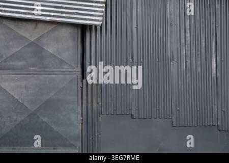 Shed wall with galvanized tin sheet metal corrugated aluminum background. Stock Photo
