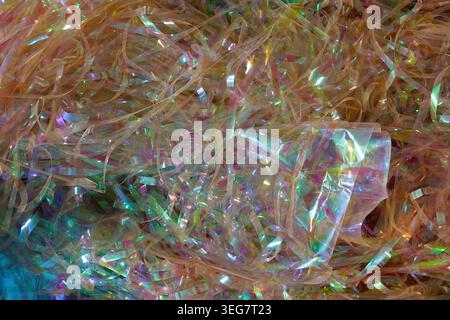 Colorful iridescent confetti ribbons abstract festive background. Stock Photo