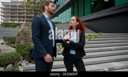 Caucasian people coworkers partners business man woman meeting city handshaking two colleagues managers workers businessman businesswoman meet Stock Photo