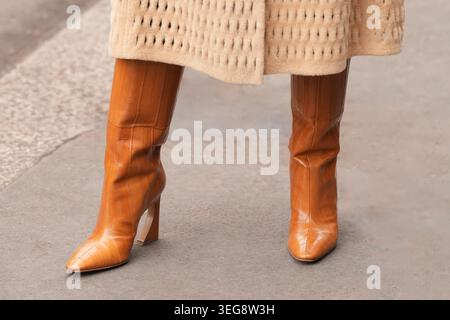 Milan, Italy - February, 25, 2026: woman wears Fendi arco leather boots. Fashion outfit shoes details, street style look Stock Photo