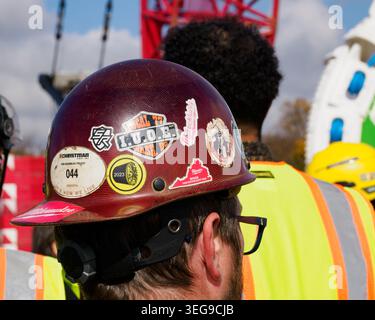 Workers at a construction site wearing hard hats and reflective vests at the TBM celebration - Arrival of Mary at West Potomac Park, Washington, DC Stock Photo