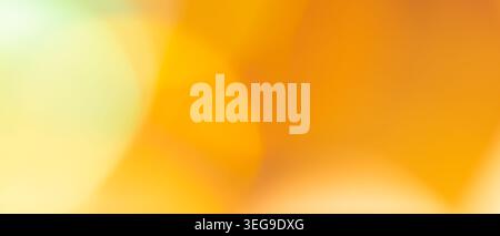 Abstract background with bright yellow orange and mint green blurred gradient for cheerful backdrop Stock Photo