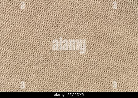Beige woven canvas fabric texture background with diagonal pattern close-up Stock Photo