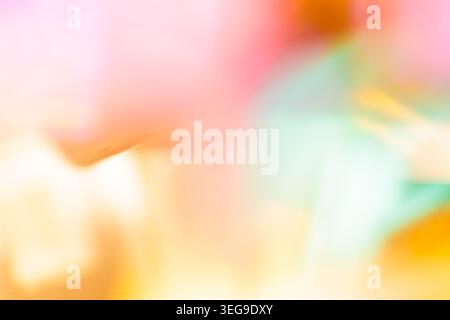 Soft pastel multicolor bokeh blurred abstract background with pink yellow and mint gradient tones Stock Photo