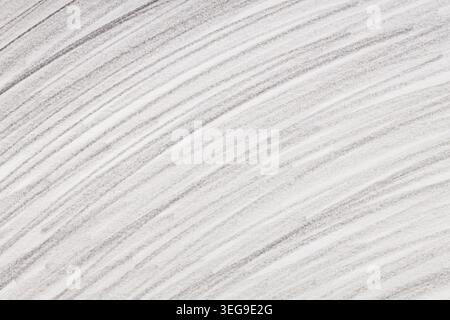 Abstract gray pencil strokes on white paper with diagonal lines for minimalist artistic background Stock Photo