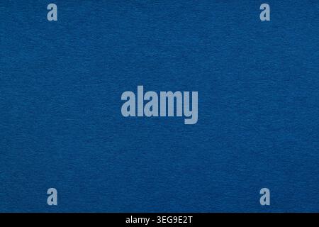 Dark blue paper texture with subtle fibers as a deep navy background for design and creative projects Stock Photo