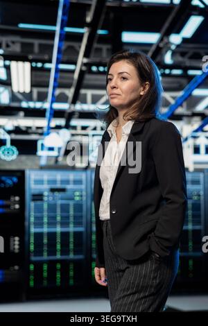 Equipment supervising, AR visualization and manager in server farm, doing maintenance. IT expert, data center, overseeing electronics, walking through supercomputers, VFX compositing concept Stock Photo