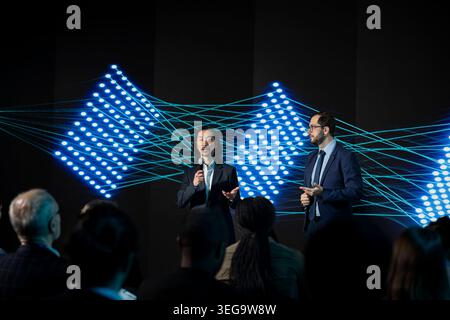 Two diverse IT technicians presenting new LLM systems with suggestions for automation, in-house developers meeting to discuss generative models and deep learning. Artificial intelligence. Stock Photo