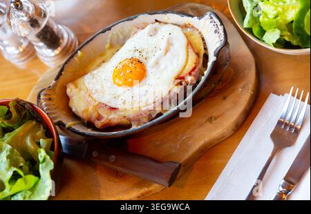Swiss cheese crust with fried egg Stock Photo