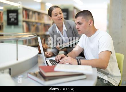 female student and a guy are preparing for lectures Stock Photo