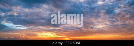 Panorama of a dramatic, tropical sunset sky as a background or texture Stock Photo