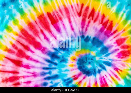 Real Authentic Tie Dye Rainbow All Colors Spectrum Spiral Pattern On Cotton Material Background Wallpaper Tye Die Stock Photo