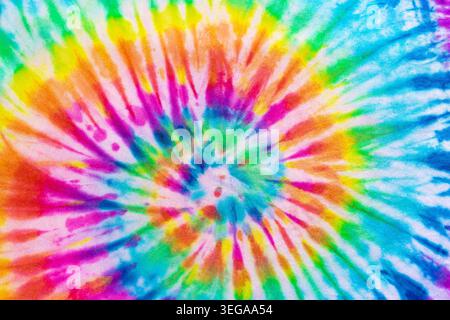Real Authentic Tie Dye Rainbow All Colors Spectrum Spiral Pattern On Cotton Material Background Wallpaper Tye Die Stock Photo