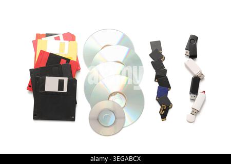 USB flash drives, CD and floppy disks on white background Stock Photo