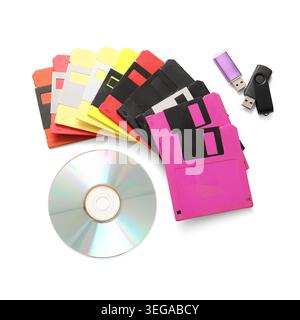 USB flash drives, CD and floppy disks on white background Stock Photo