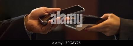 Adult Customer Making Contactless Payment with Smartphone Stock Photo