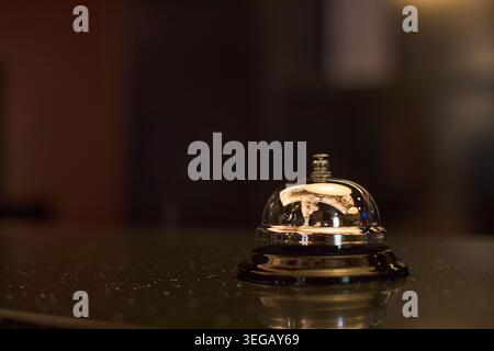 Hotel Reception Bell Standing on Counter for Guest Service Stock Photo