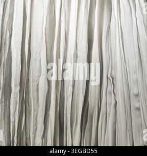 A crumpled white curtain as a background Stock Photo