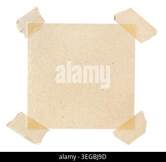 Square piece of blank brown paper affixed with four pieces of masking tape isolated on white background Stock Photo