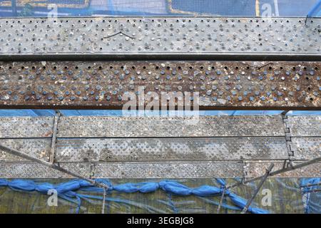 High angle view of a Scaffolding structure providing temporary access with platforms and protective netting Stock Photo